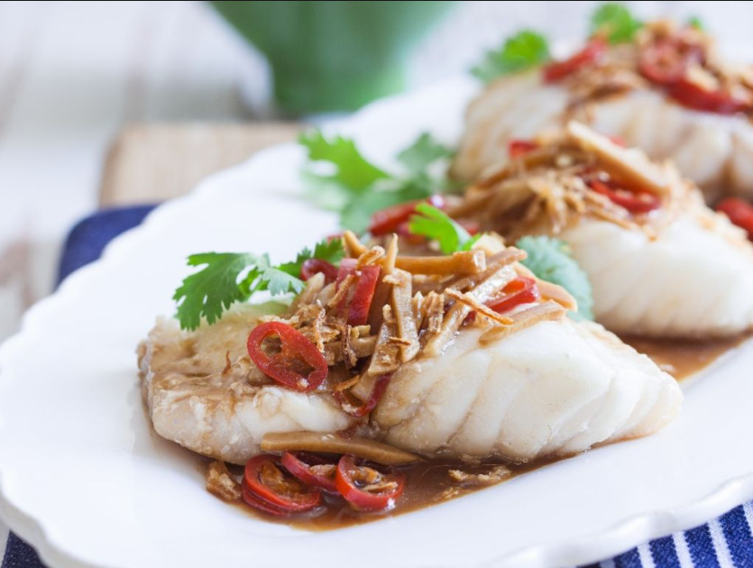 Cooked monkfish recipe served with herbs
